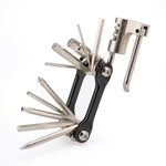 Set of metal tools including a hex key and screwdriver on a white background