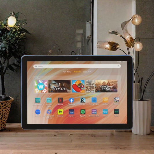 Smart display device on a wooden surface with a home screen interface in a room setting.
