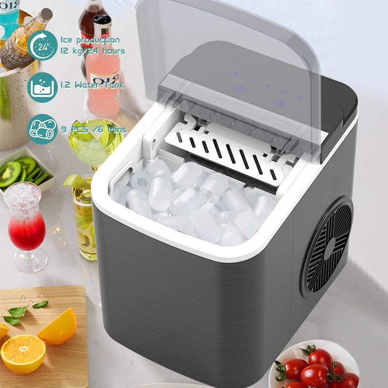 Portable ice maker with ice production and water tank features, surrounded by drinks and fruits.