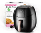 Black air fryer with digital display next to its packaging on a white background