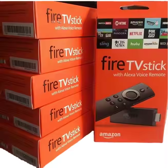 Stack of Amazon Fire TV Stick boxes with a close-up of one box showing the product and branding.