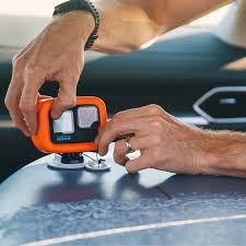 Person using a device on a car dashboard