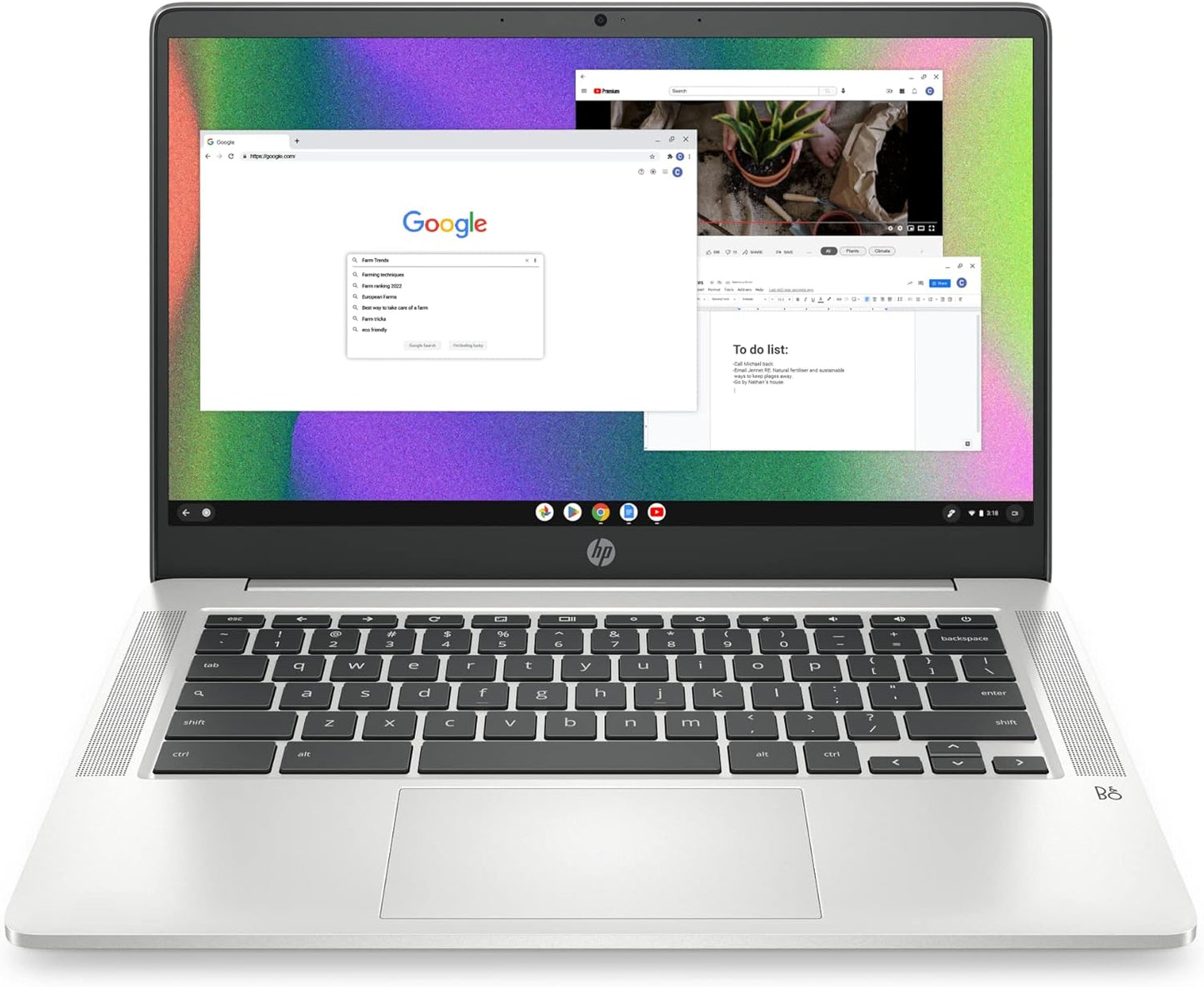 Laptop displaying a colorful screen with Google search bar on a white background