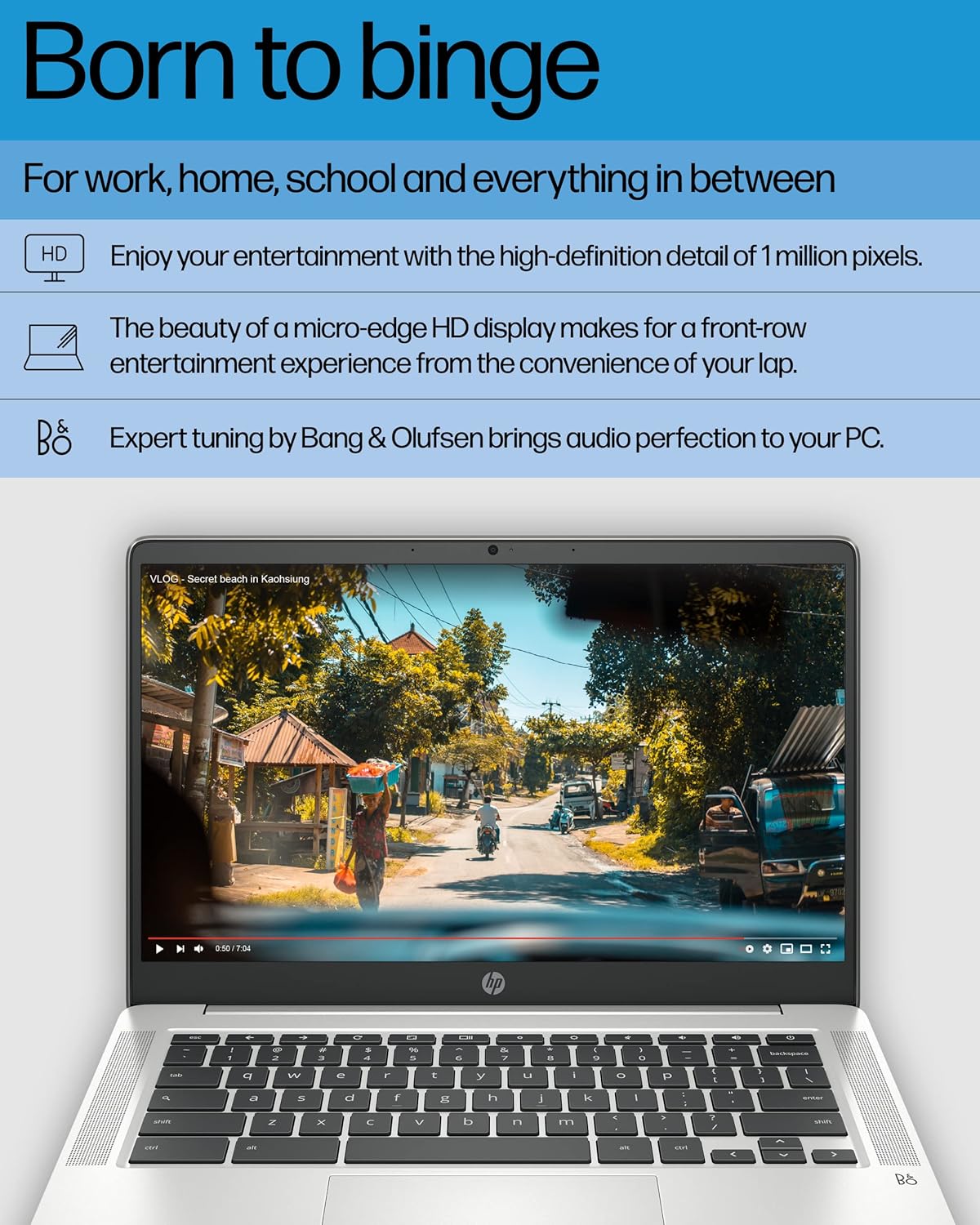 Laptop displaying a scenic road with text about entertainment and audio quality.