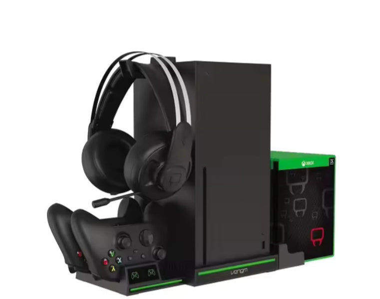 Gaming console with headset and controllers on a white background