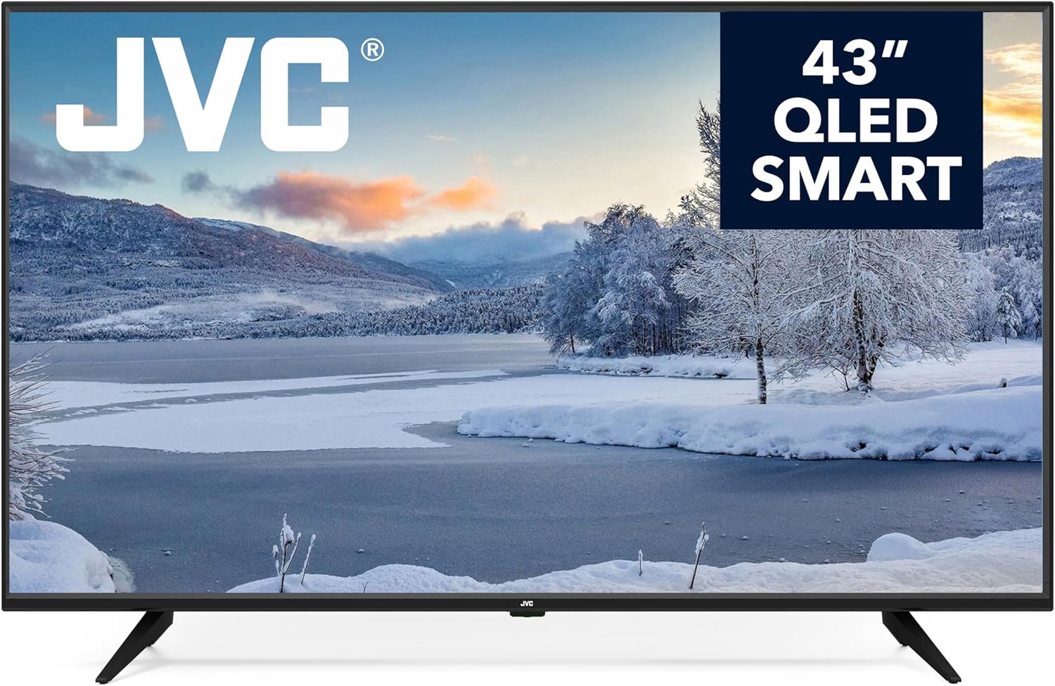 JVC 43-inch QLED smart TV displaying a winter landscape with snow-covered trees and mountains.