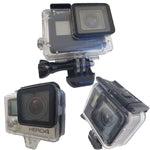 Three GoPro camera housings on a white background